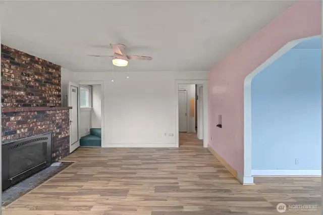 Front entrance opens to sitting room with fireplace