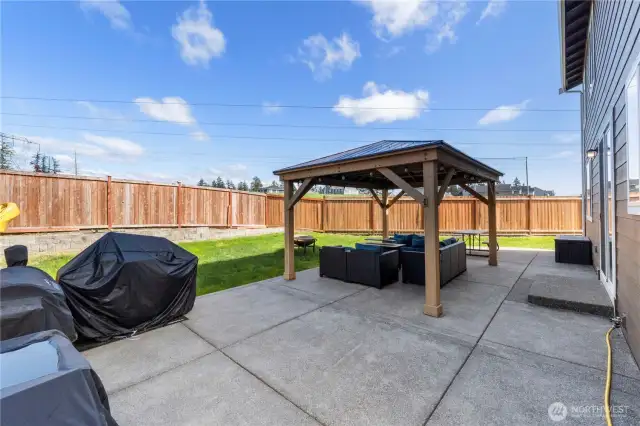 Fully-fenced backyard with upgraded large back patio.