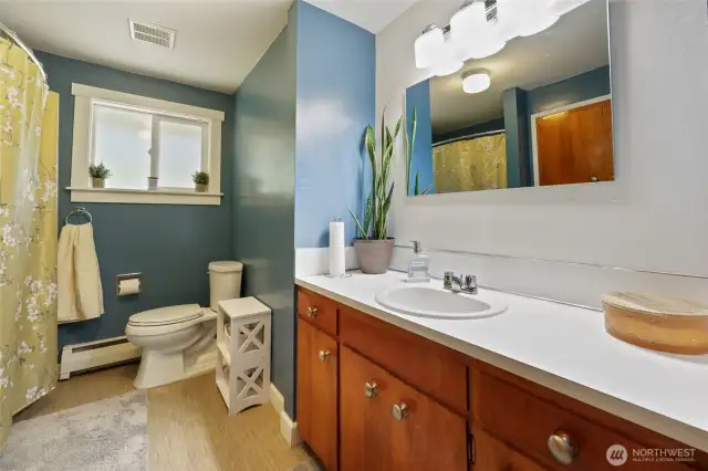 Main level hall bathroom with built-in laundry chute