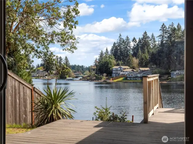 A sliding door off the entry takes you outside to the lake
