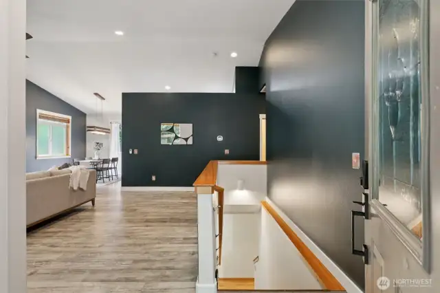 Come on in! The main level offers an open layout and a primary bedroom, while the lower level includes a rec room and three more bedrooms.