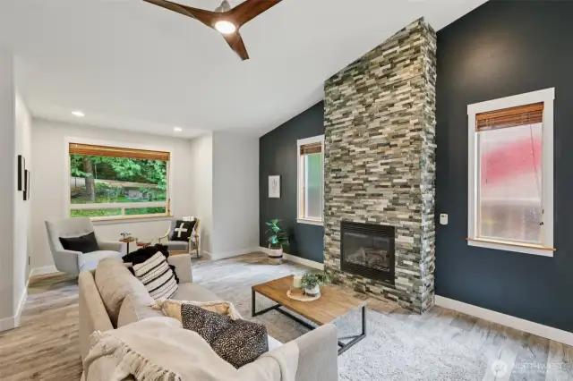 Living room with gas fireplace and cozy reading nook.