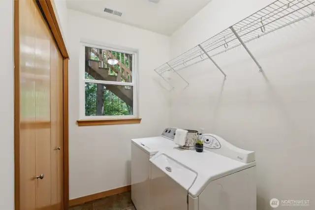 Laundry room with extra storage.