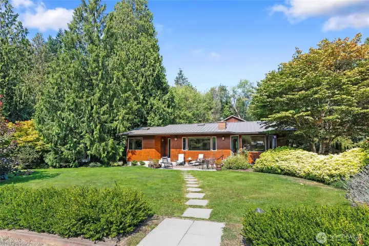 Lovely landscaping surrounds this special home.