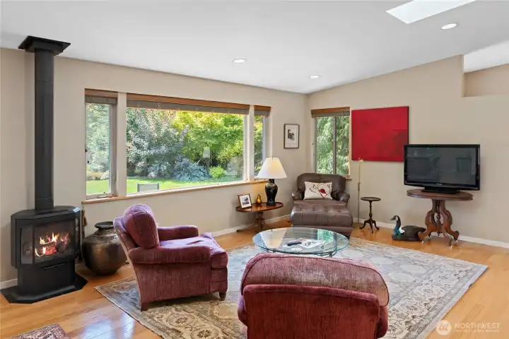 Cozy propane free standing stove in living room/dining room spaces.