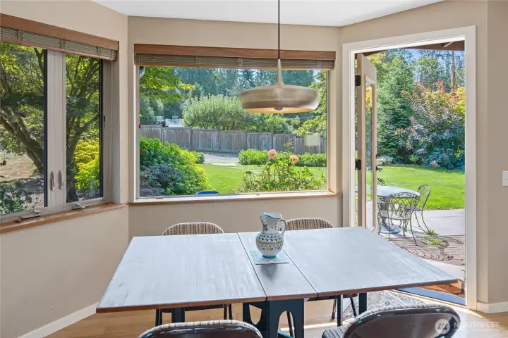 Dining area off kitchen has full light door to patio, lots of windows.