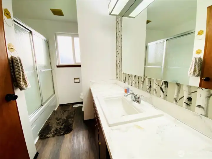 Full bath with new sink, countertop and a nice big tub/shower combo.