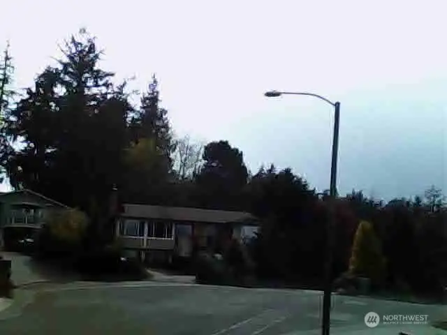 This view would be similar to what you'd see from a second story home you build on this lot. It is looking Southwest into the culdesac. This view would be similar to what you'd see from a second story home you build on this lot. It is looking Southwest into the culdesac.