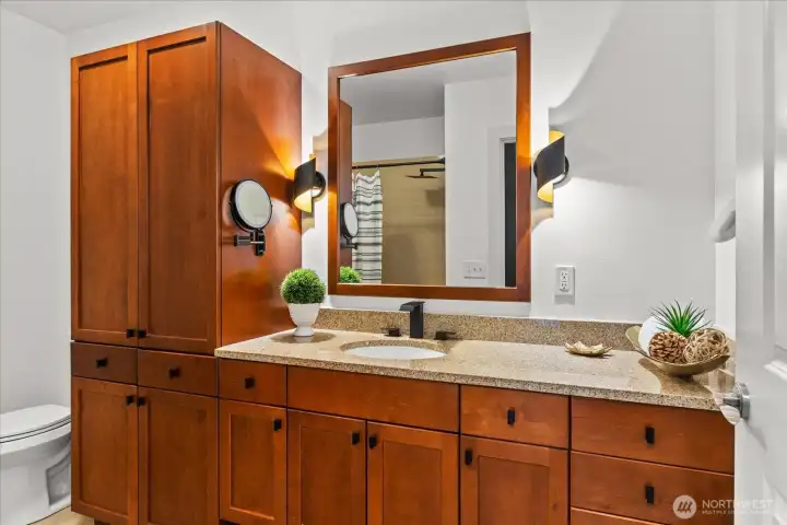 Full bath has ample line storage