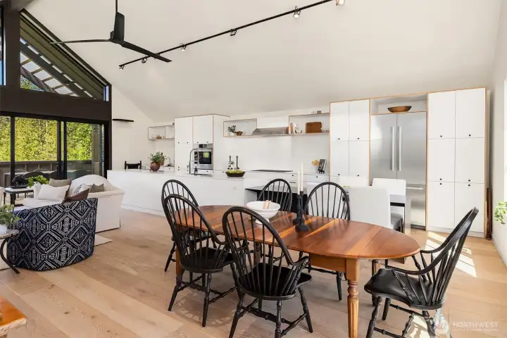 Looking from the dining area to kitchen and living area.