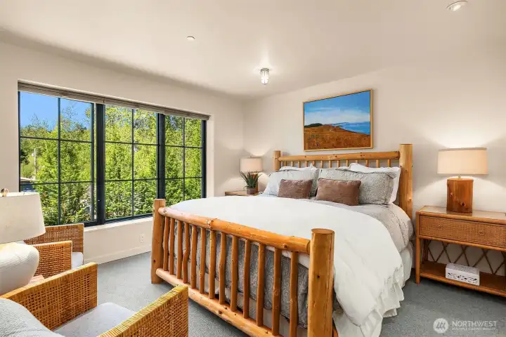 The primary suite overlooks the back tree lined part of the community to the west with