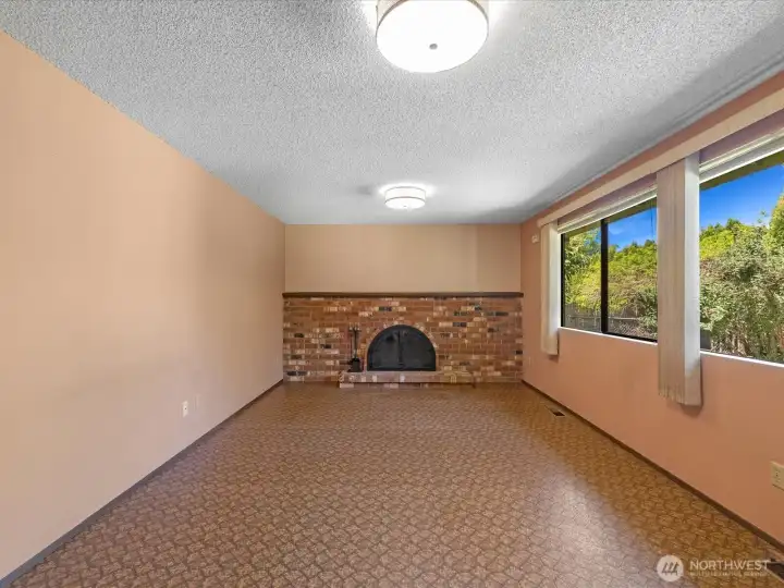 Huge family room with wood buring fire place.