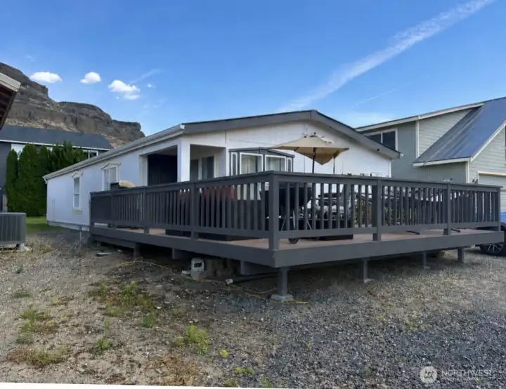 Home has new trim paint including the deck railing. This is AI to show what it will look like.