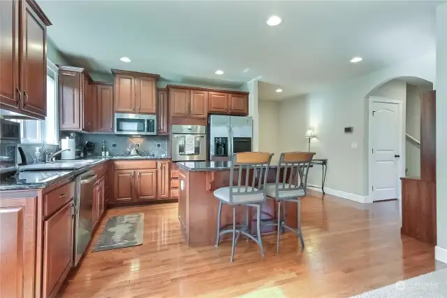 You will love the beautiful kitchen with breakfast bar, stainless appliances, granite countertops, and pantry.