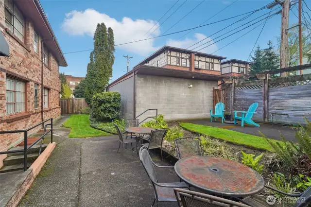 Unwind in the fully fenced common patio area—ideal for relaxing or catching up with neighbors