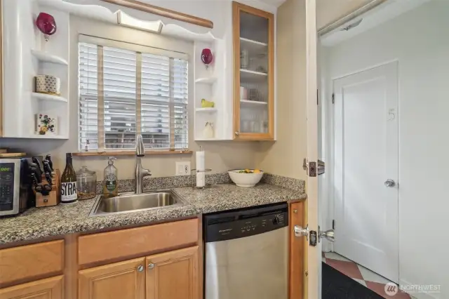 Just off the kitchen, you'll find a private storage closet, plus an additional shared laundry room downstairs