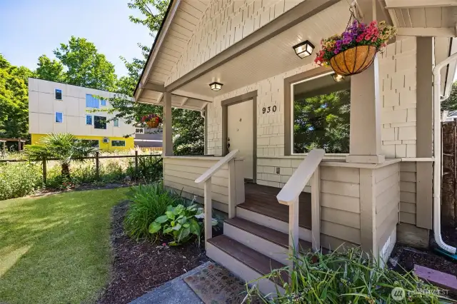 Welcome home! Covered front porch with composite decking invites you in with style and durability.