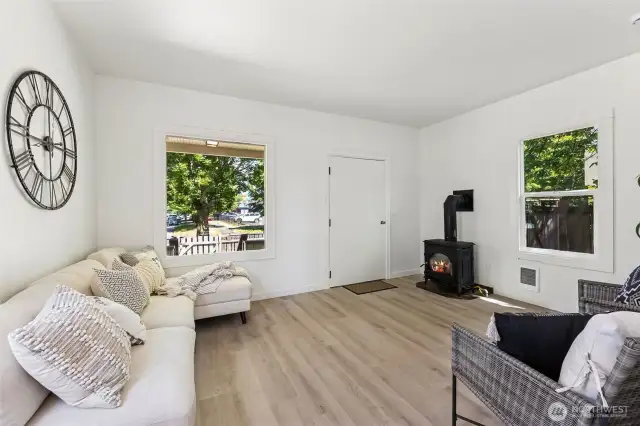 The perfect place to unwind—sunlit by day, cozy by the gas fireplace at night.