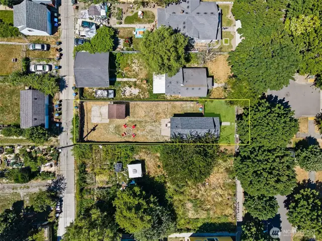 Large fully fenced lot with alley access—ideal for ADU potential or expanded parking.