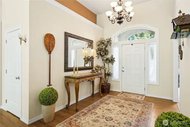 Spacious foyer with high ceilings offers an open, airy welcome.