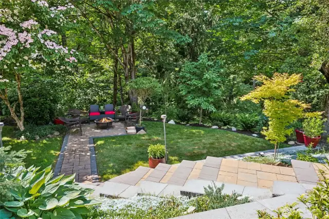 Beautifully laid pavers connect the upper yard to the lower yard.