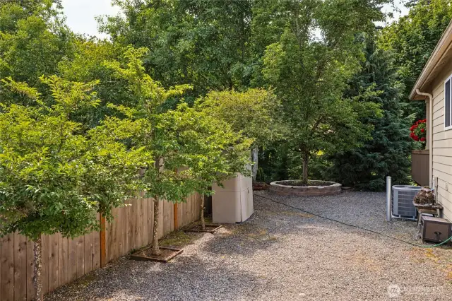 Practical side yard includes extra parking space.