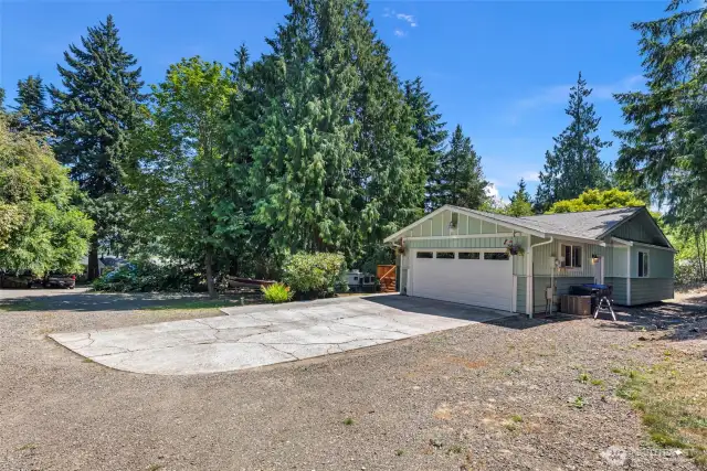 Large level lot with mature trees and plenty of room for RV parking.