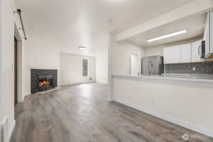 Relax, entertain, and unwind in your open-concept living room with a cozy fireplace centerpiece.