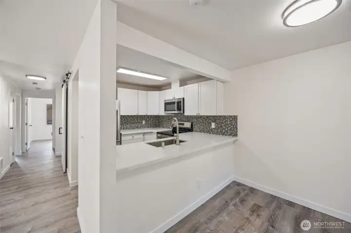 Bright + modern kitchen open to the living space for effortless entertaining.