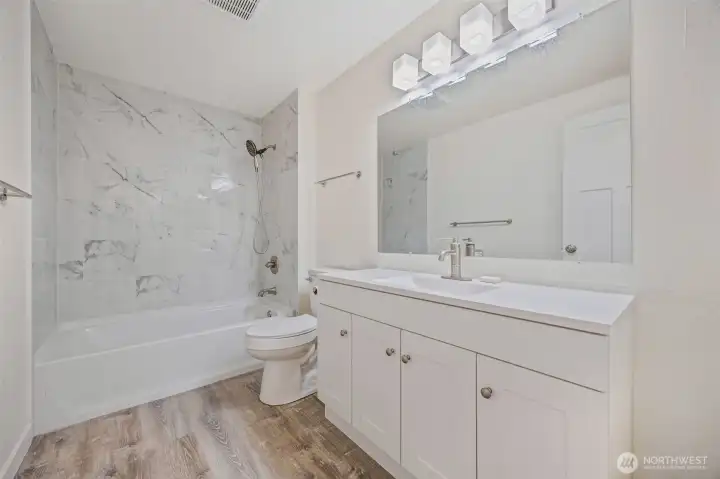 Freshly updated bath featuring stylish fixtures and clean lines.
