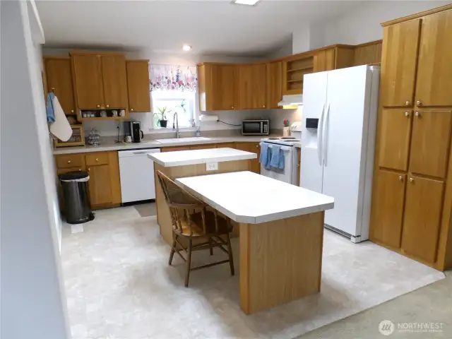 Kitchen with full appliances and a handy island to share meals on or prepare for your event.