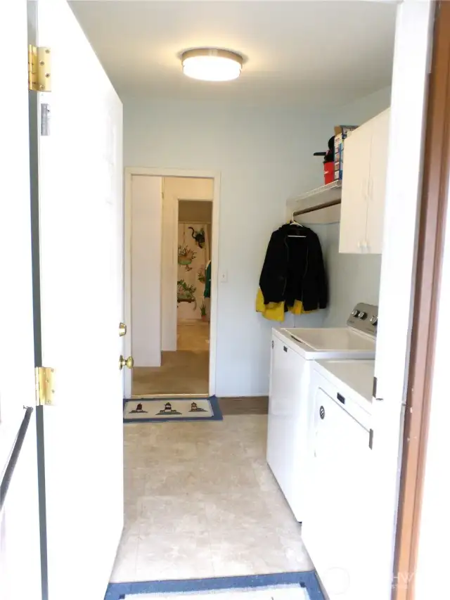 Laundry room goes to the hallway at south end of house.