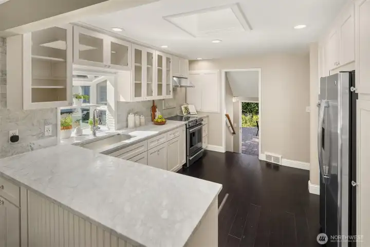 Plentiful cabinets, marble slab countertops.
