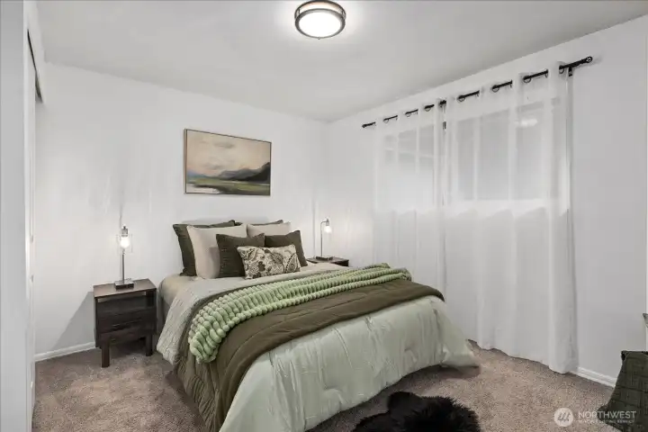 Bedroom #1 overlooks the private backyard.