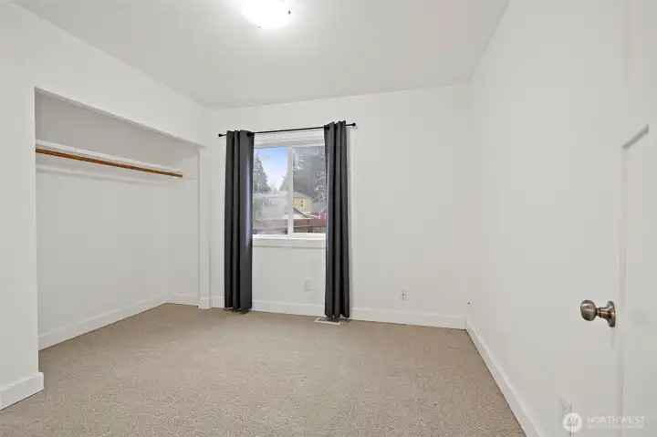 The 3rd bedroom is at the back of the house, just off the dining space and next to the main full bathroom. Fresh new carpet here too!