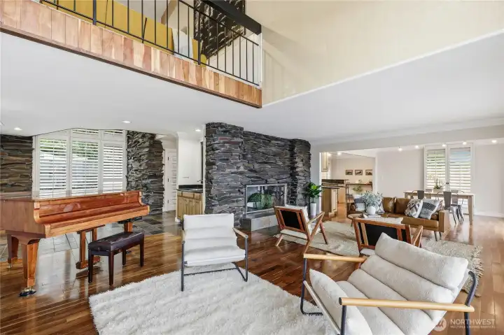 Expansive living room. Fireplace is a bold feature.