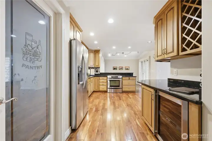 So much great storage in this home. Love the beverage fridge and wine storage.