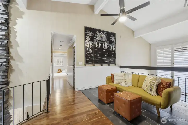 Second floor landing features some incredible artwork that conveys with the home.