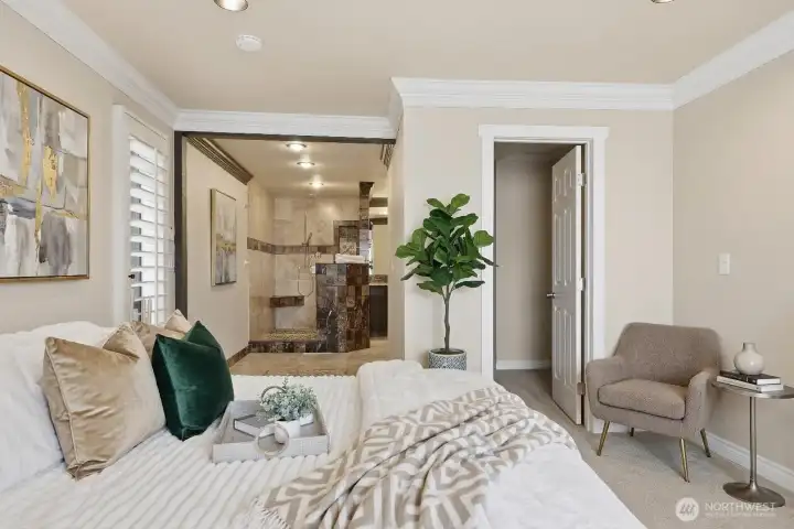 Primary bedroom with bath, walk in closet and private deck with views of the water and Olympics! some items virtually staged.