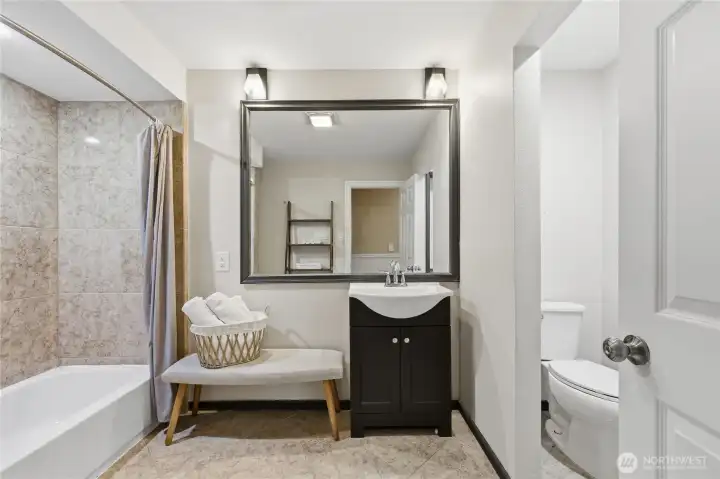 Full bath on second floor with tub and separate water closet.