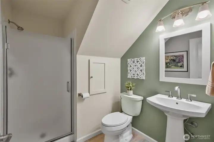 Lower level 3/4 bathroom with a bedroom just across the hall.