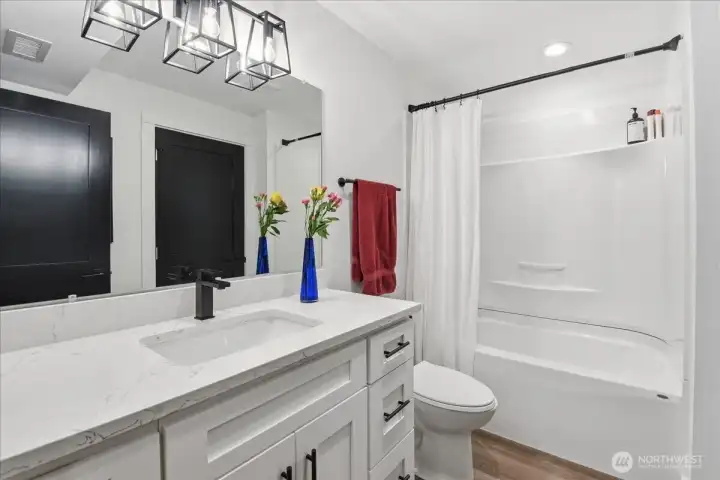 Studio full bath downstairs with seperate washer and dryer hook up.