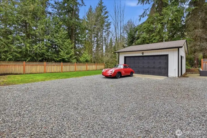 No shortage of play space or parking here.Note that the wood fence is not the property line. The property goes beyond the fence into the woods behind.