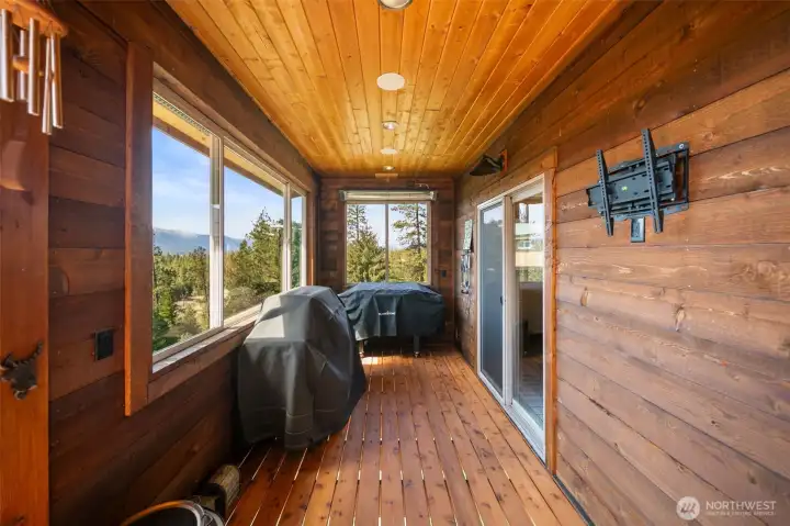 Covered & wind protected grilling area plumbed for gas & wired for TV & sound