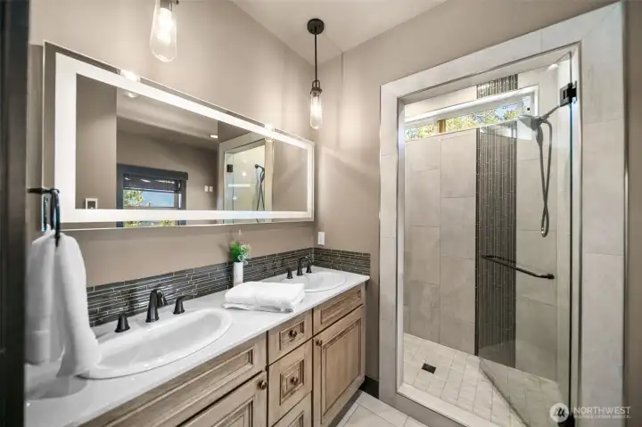 Full Primary Ensuite with large soaking tub, heated floors & heated toilet seat