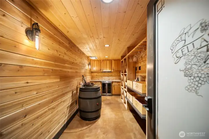 Beautiful custom wine cellar w/wine fridge & shelving for all your wine
