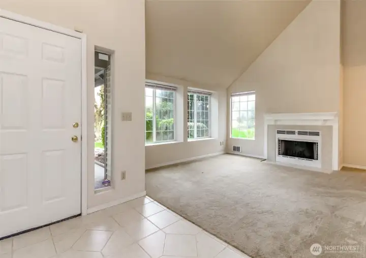 Cathedral ceilings with wood burning fireplace and large windows