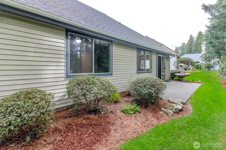 Private patio and yard with greenbelt views