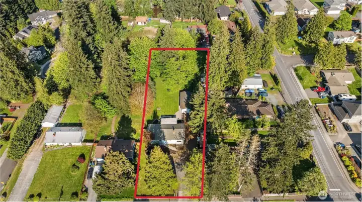 This home is on over half an acre with the home set well back from the street and a huge park-like back yard. Lot lines are approximate. Buyer to verify. Detached garage and an oversized shed also on the property. Offstreet private parking for multiple vehicles.
