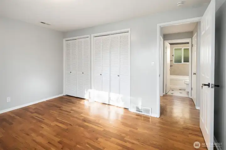 This view of the primary bedroom shows the two closets.
